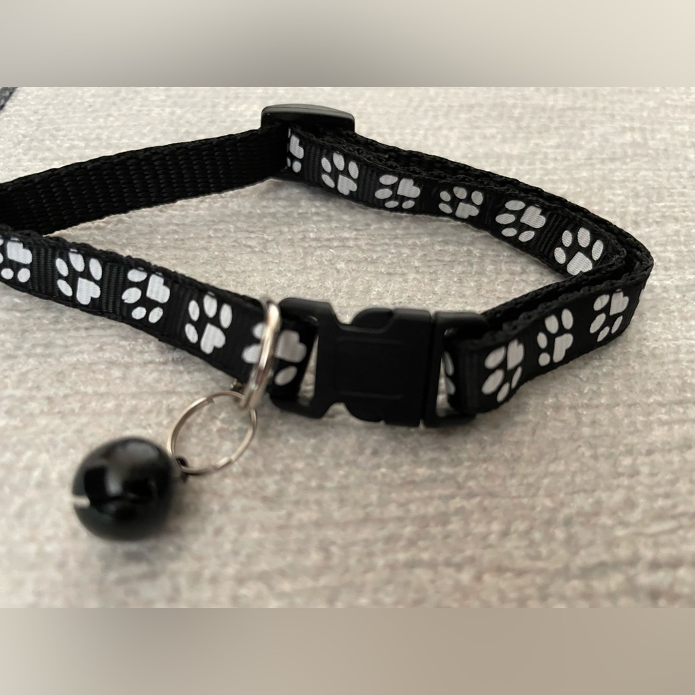 Collar with White Paw Print Pattern and Matching Bell and Buckle